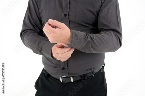 Hand organizing sleeve of shirt isolated on white background