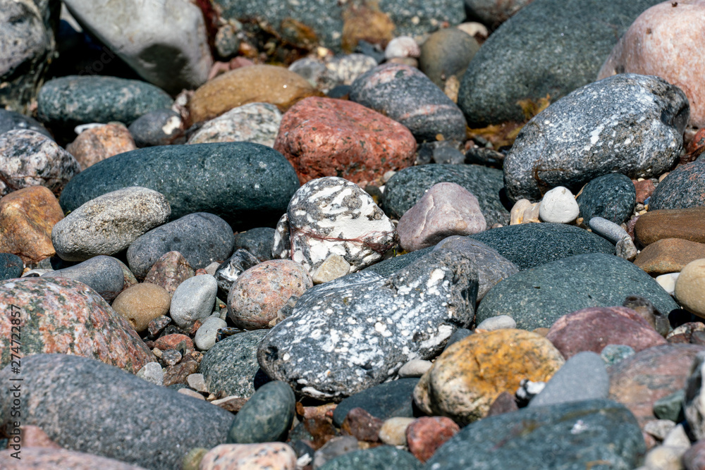 Multi coloured pebbles on a beach Multi coloured pebbles on a beach