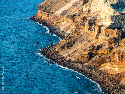 rocky volcanic coast of Santotini in Greece in the Mediterranean Sea