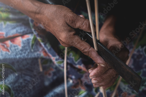 Grandma inventing things from bamboo.