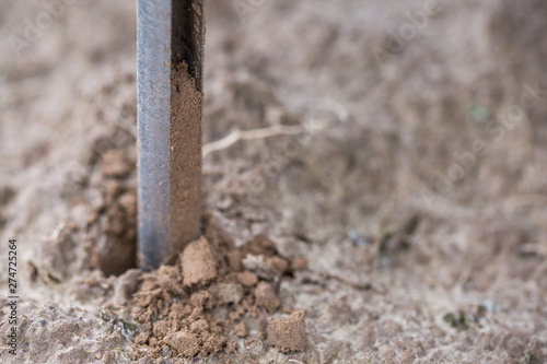 Soil Sampling. Automated probe for soil samples taking sample with soil probe sampler. Environmental protection, organic soil certification, research.