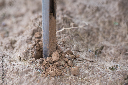 Soil Sampling. Automated probe for soil samples taking sample with soil probe sampler. Environmental protection, organic soil certification, research.