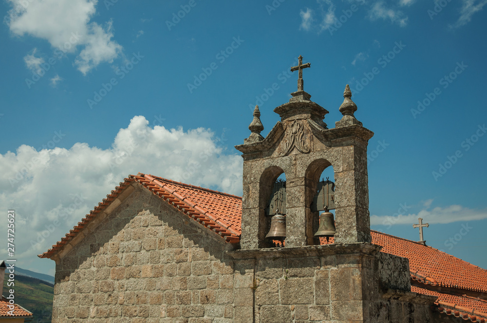 Church roof and campanile with bronze bells