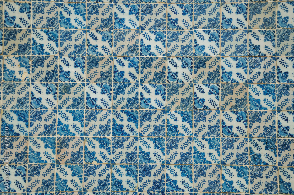 Blue floral pattern hand-painted in baroque style on ceramic tiles Blue floral pattern hand-painted in baroque style on ceramic tiles