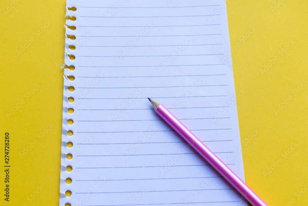 empty notebook with on yellow background. empty notebook with on yellow background.