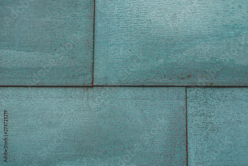 background of metal panels painted in turquoise