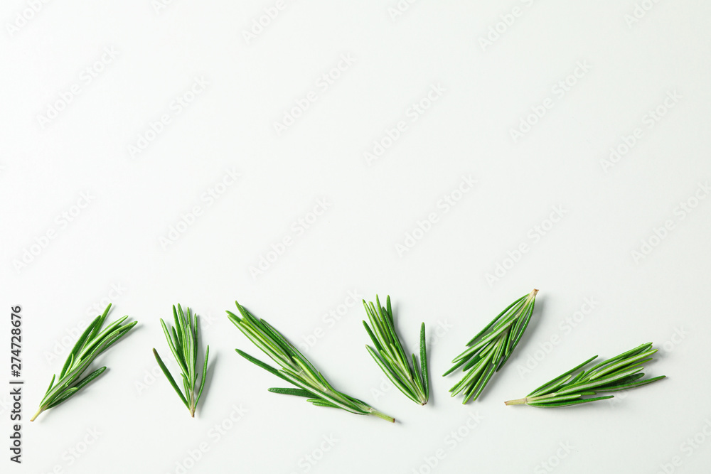 Flat lay composition with rosemary on white background, space for text - obrazy, fototapety, plakaty 