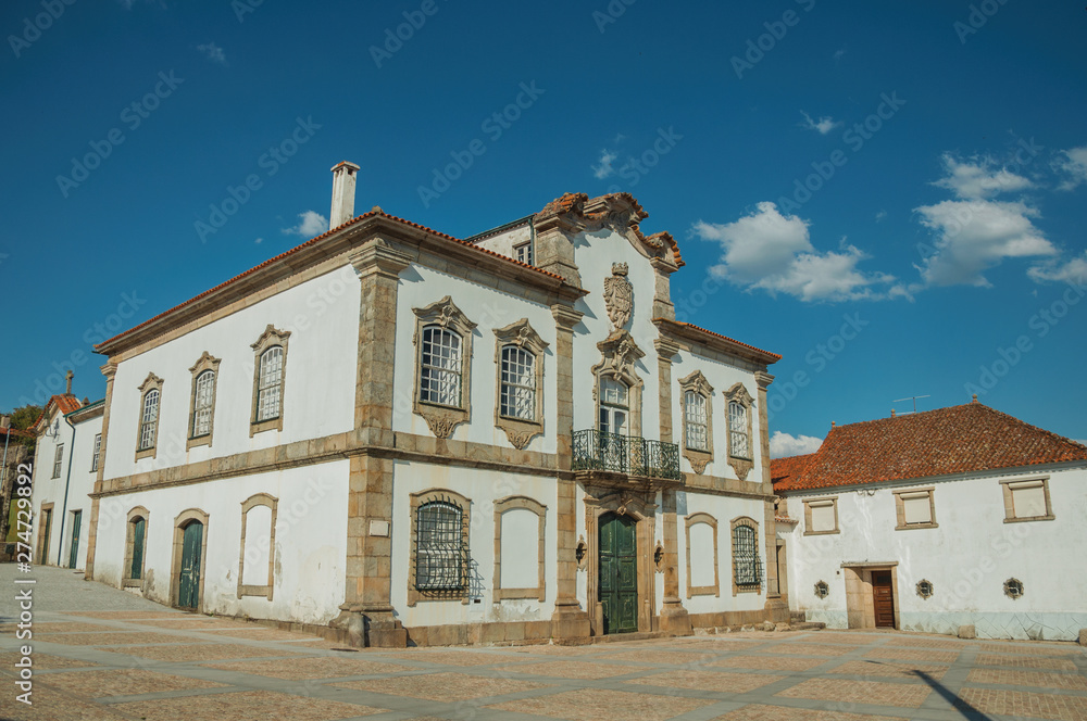 Mansion facade in baroque style on a deserted square