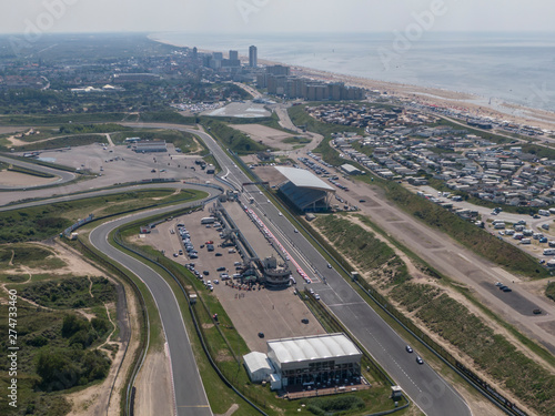 Aerial of motor sport race track with the north sea beach and the village of Zandvoort in the Netherlands