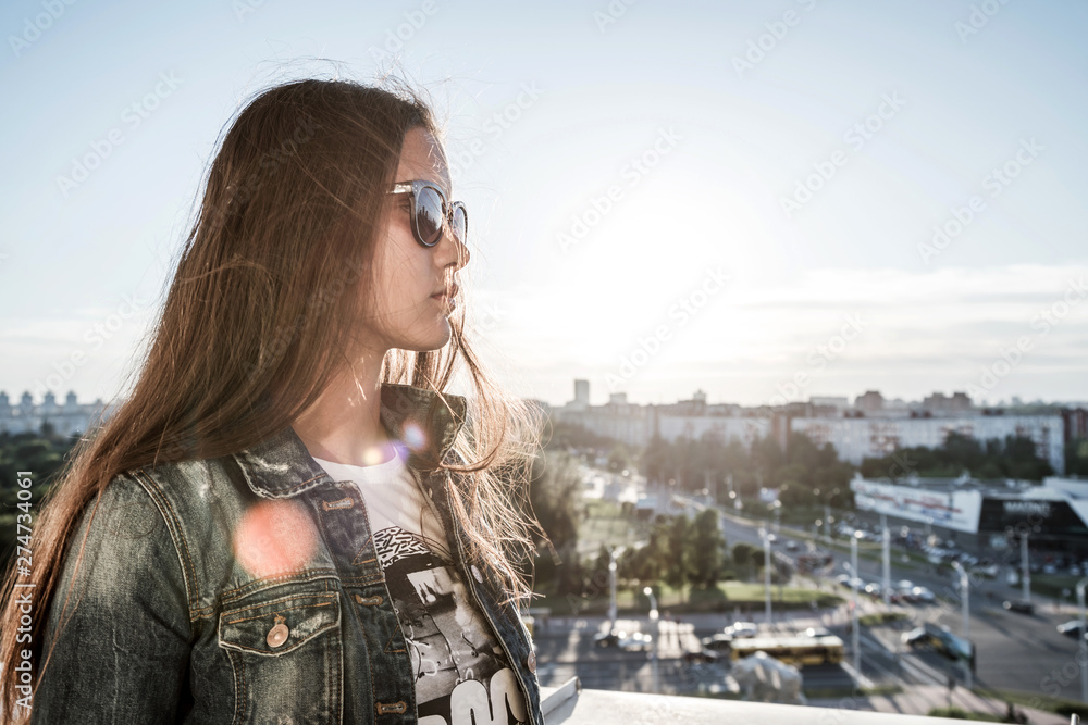 Fototapeta premium girl hipster tourist sightseeing in city standing on balcony of observation deck of building
