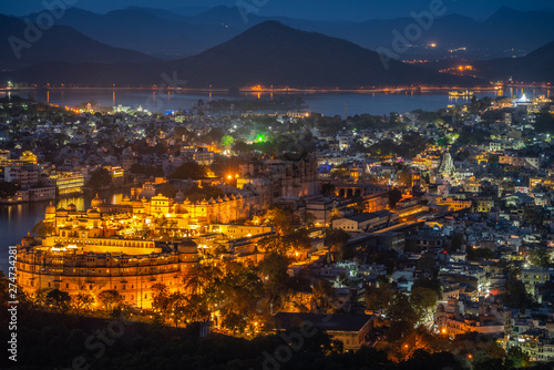 Aerial view of City Palace after sunset. Udaipur, Rajasthan, India