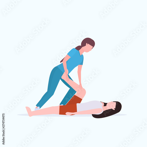 female personal trainer doing stretching exercises with girl fitness instructor helping woman to stretch muscles workout concept flat full length