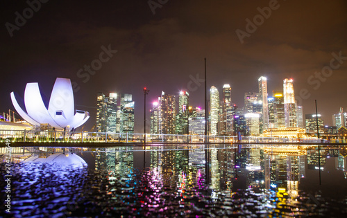 Photography SINGAPORE, SINGAPORE - MARCH 2019: skyline of Singapore Marina Bay at night down