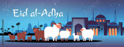 happy Eid al-Adha mubarak muslim holiday concept white and black flock of sheep festival of Sacrifice nabawi mosque building night cityscape flat full length horizontal