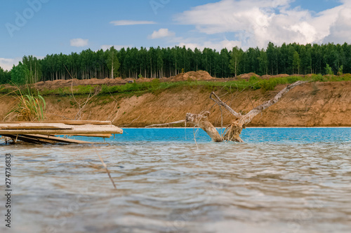 Beautiful turquoise lake in Novosibirsk. Dangerous lake with waste from the Novosibirsk thermal power station