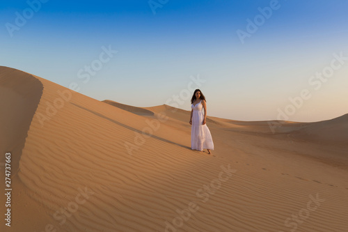 UAE. Woman in desert