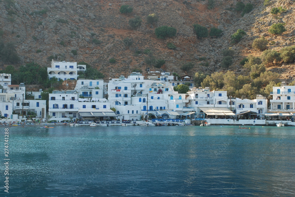 Beautiful Greek blue and white houses on the shores of Crete in the Mediterranean