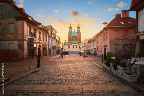 Historical road leading towards Gniezno Royal Cathedral on a sunset. photo