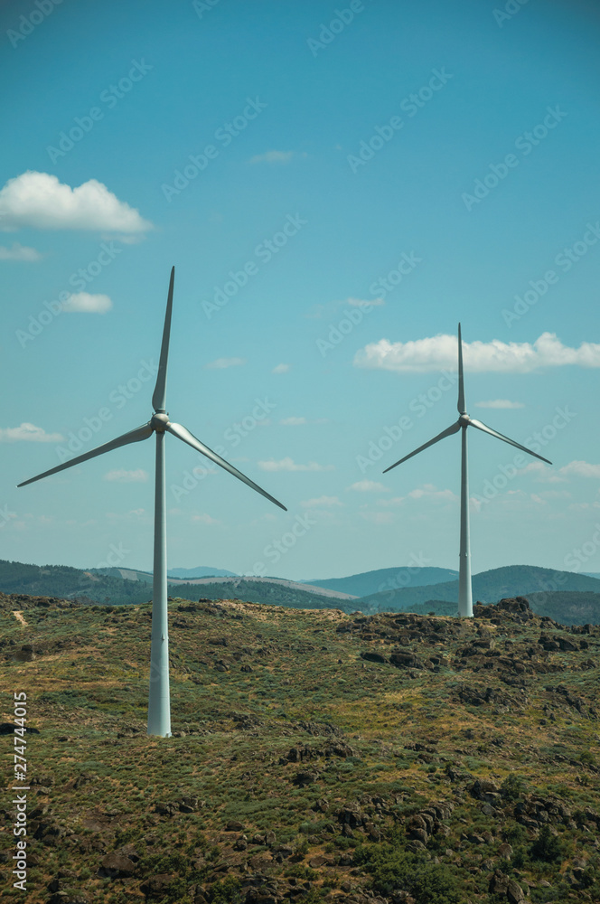 Wind turbines over hilly landscape Wind turbines over hilly landscape