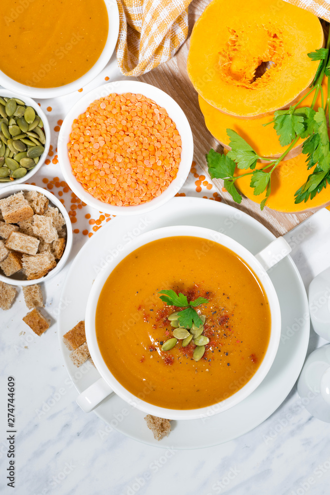 soup of pumpkin and lentils and ingredients, vertical top view soup of pumpkin and lentils and ingredients, vertical top view