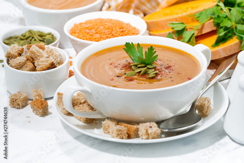 soup of pumpkin and lentils and ingredients