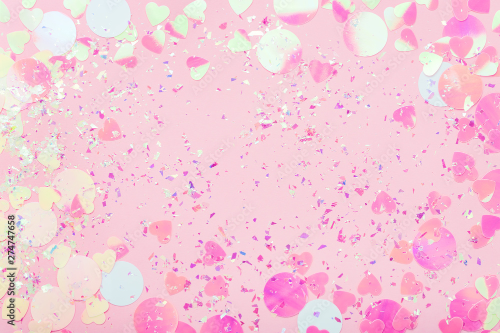 Colorful Confetti and sparkles on pink pastel trendy background. Festive frame, holiday backdrop. Flat lay, copy space. - obrazy, fototapety, plakaty 