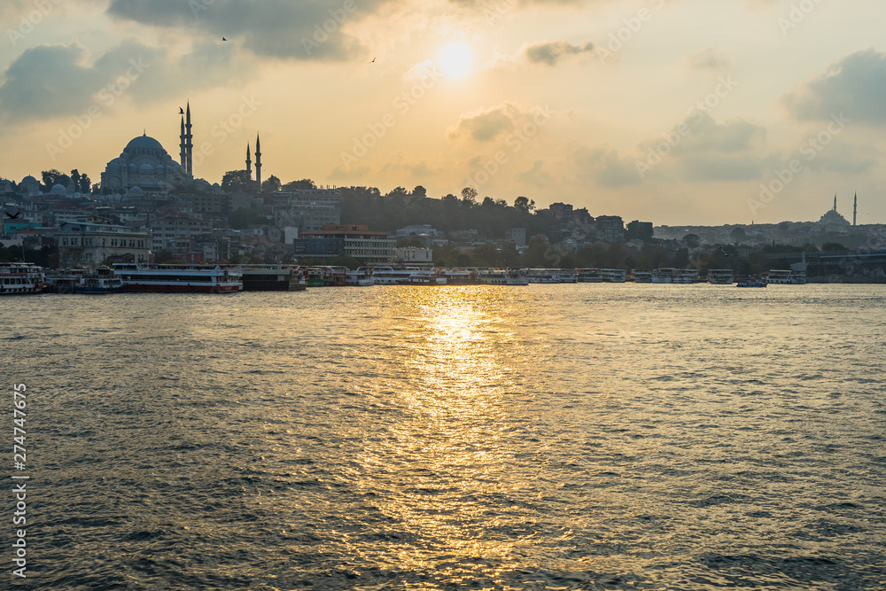 Istanbul skyline at sunset dominated by Suleymaniye Mosque, the second largest mosque in Istanbul, built in 1550.