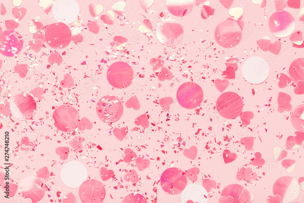 Glitter sparkles Confetti on pink pastel background. Festive holiday backdrop. Flat lay. Glitter sparkles Confetti on pink pastel background. Festive holiday backdrop. Flat lay.