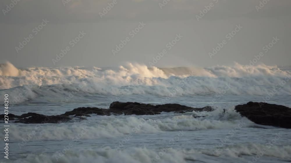 Surge of waves close to sunset at beautiful beach in South Africa Surge of waves close to sunset at beautiful beach in South Africa