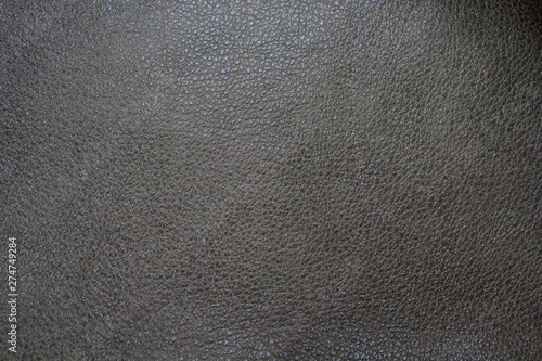 The texture of leather with free space for text. Genuine leather for furniture. Gray leather.