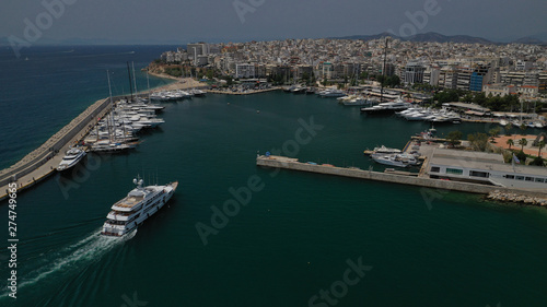 Aerial view photo of luxury yacht entering Marina Zeas, Piraeus, Attica, Greece