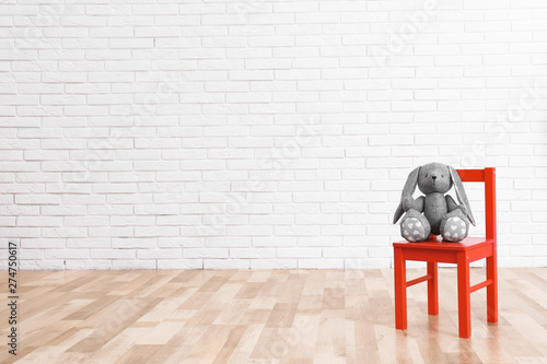 Stuffed toy rabbit on chair...