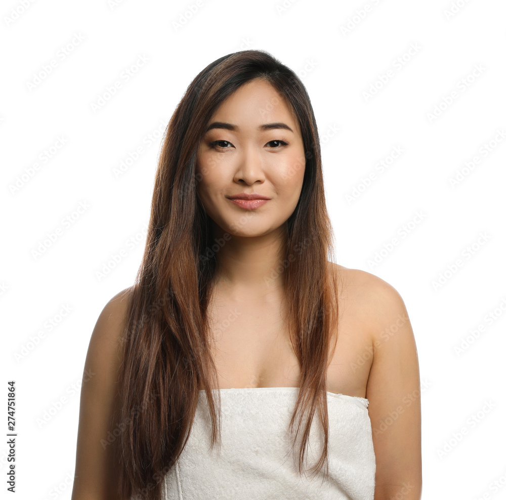 Portrait of beautiful Asian woman wrapped in towel isolated on white. Spa treatment Portrait of beautiful Asian woman wrapped in towel isolated on white. Spa treatment