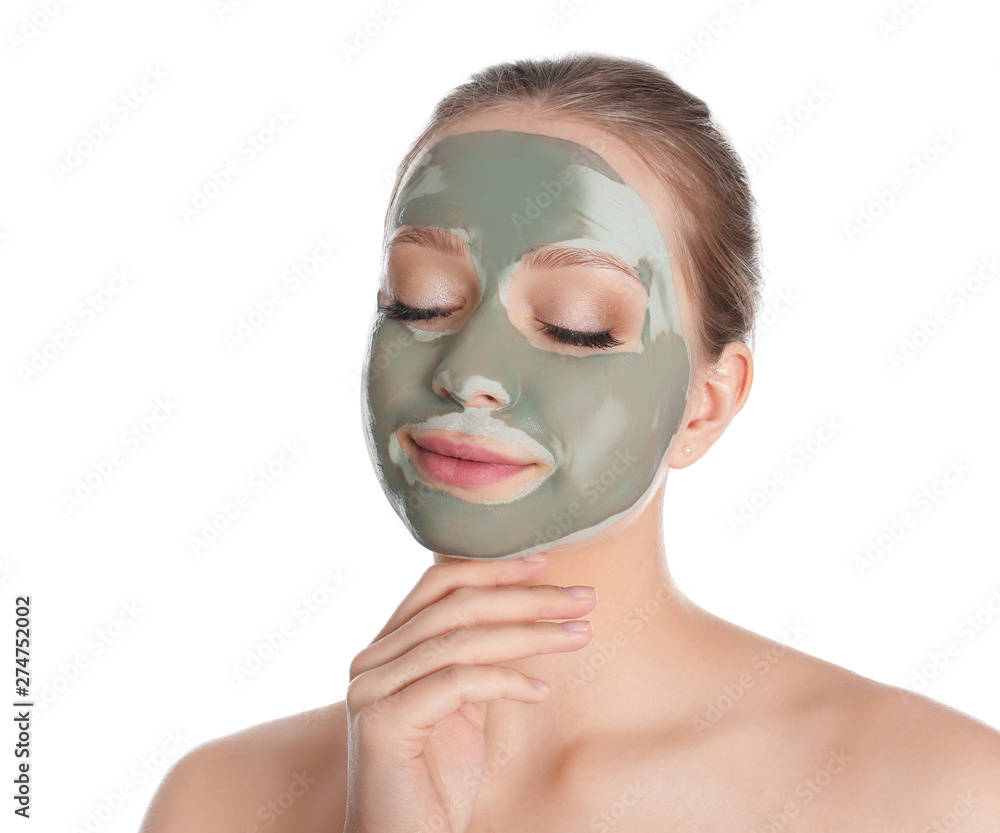 Beautiful woman with clay mask on her face against white background Beautiful woman with clay mask on her face against white background