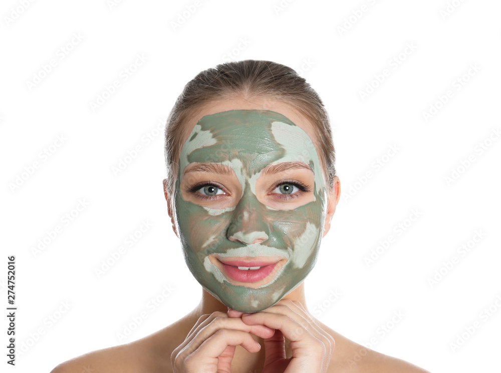 Beautiful woman with clay mask on her face against white background Beautiful woman with clay mask on her face against white background