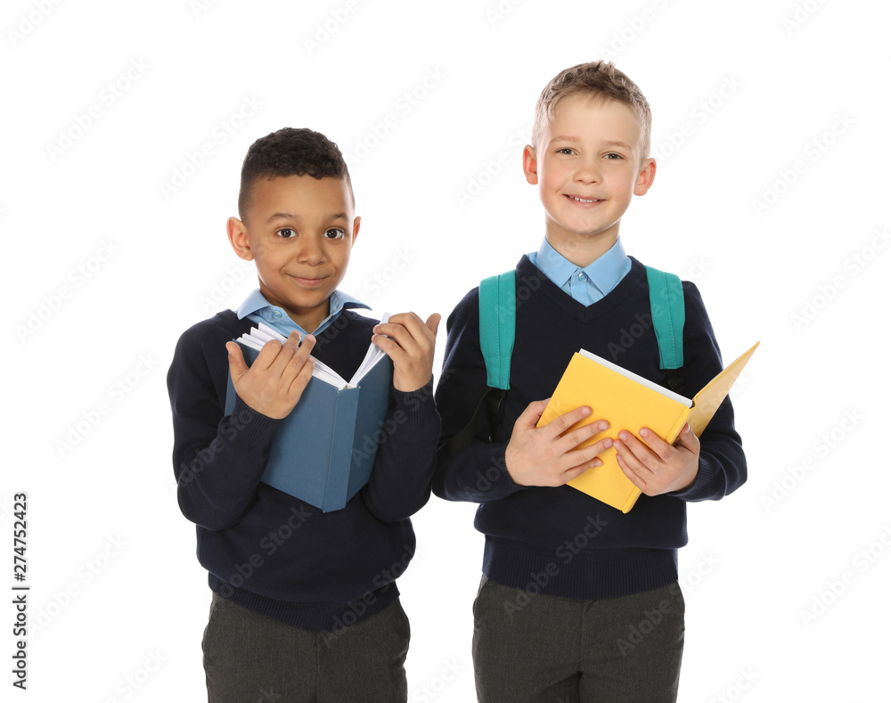 Portrait of cute children in school uniform with books on white background Portrait of cute children in school uniform with books on white background