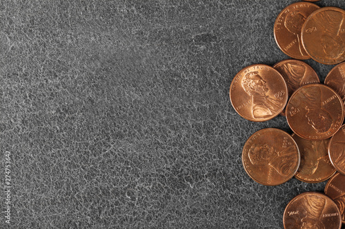 Fotografia Many coins on color background, top view. Space for text