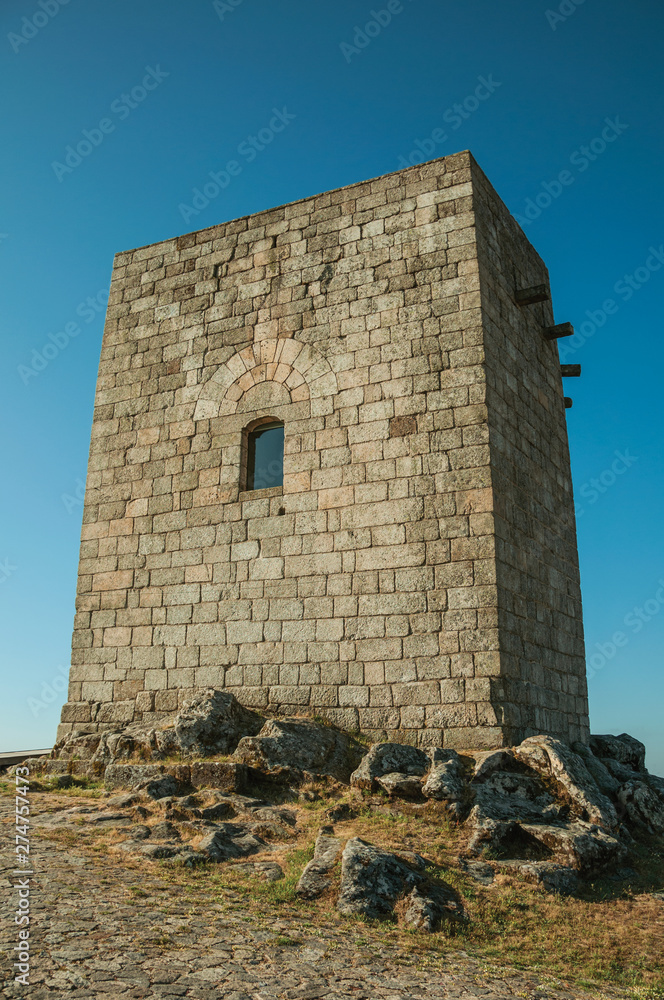 Stone square tower over rocky hill at Guarda