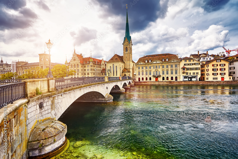 Zurich, Switzerland. View of the historic city center with famous Fraumunster Church, on the Limmat river Zurich, Switzerland. View of the historic city center with famous Fraumunster Church, on the Limmat river