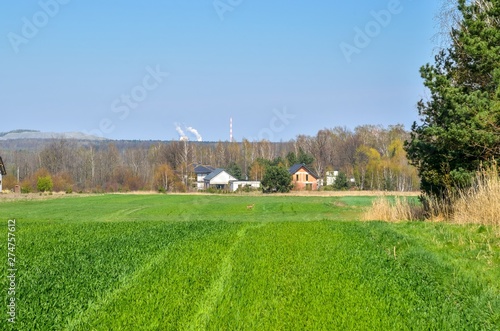 Spring rural landscape. Construction of a new home in the countryside.