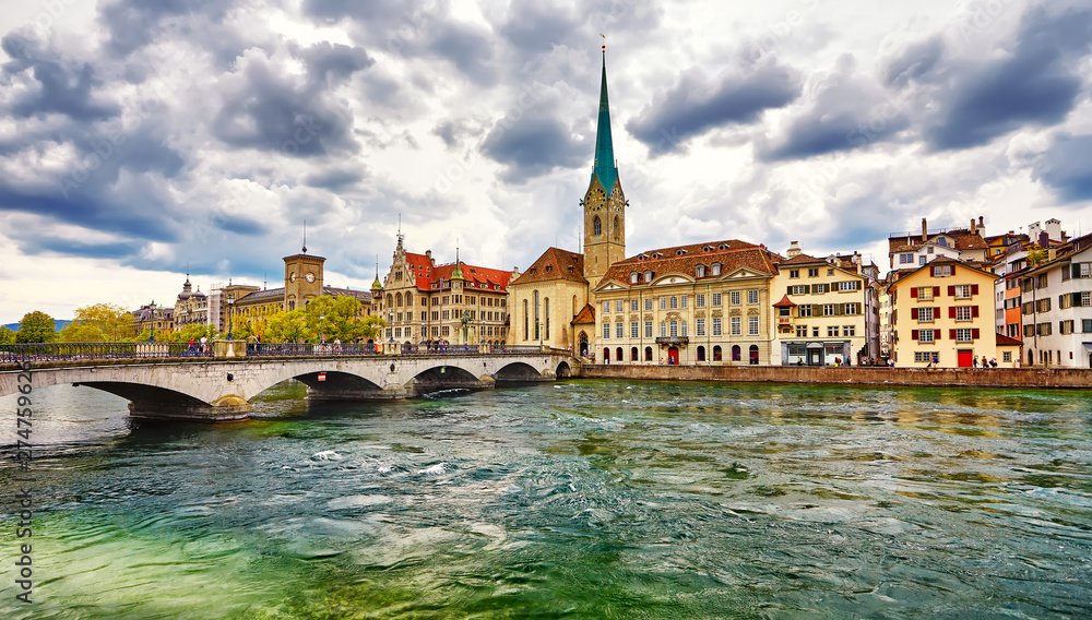 Fototapeta premium Zurich, Switzerland. View of the historic city center with famous Fraumunster Church, on the Limmat river