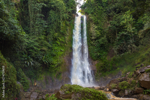 Nung-Nung Bali waterfall in rainforest.
