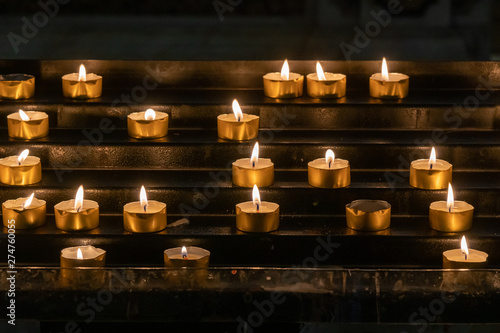 Canvas Print Candle Light in a church for prayers and remembrance