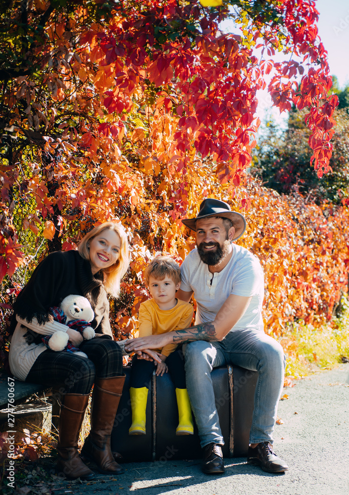Ready for long journey. Father and mother suitcase and son. Bearded dad and mom telling son about travelling. Start new adventure. Parenthood and upbringing. Family time. Adventure with son Ready for long journey. Father and mother suitcase and son. Bearded dad and mom telling son about travelling. Start new adventure. Parenthood and upbringing. Family time. Adventure with son
