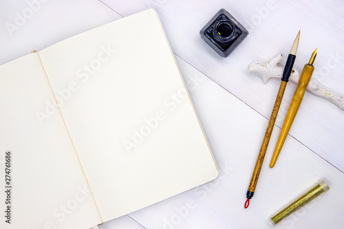 Wallpaper Mural Sketchbook blank page. Notebook top view photo on white background. Minimal flat lay with drawing tools and gold glitter Torontodigital.ca