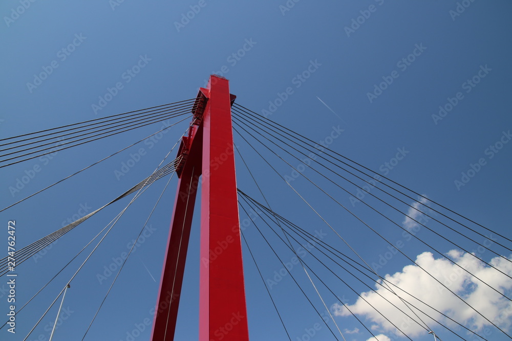 Red colored Willemsbrug over river Nieuwe Maas in Rotterdam, the Netherlands Red colored Willemsbrug over river Nieuwe Maas in Rotterdam, the Netherlands