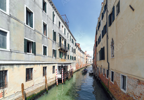 Venetian canal in sunny day. Italy.