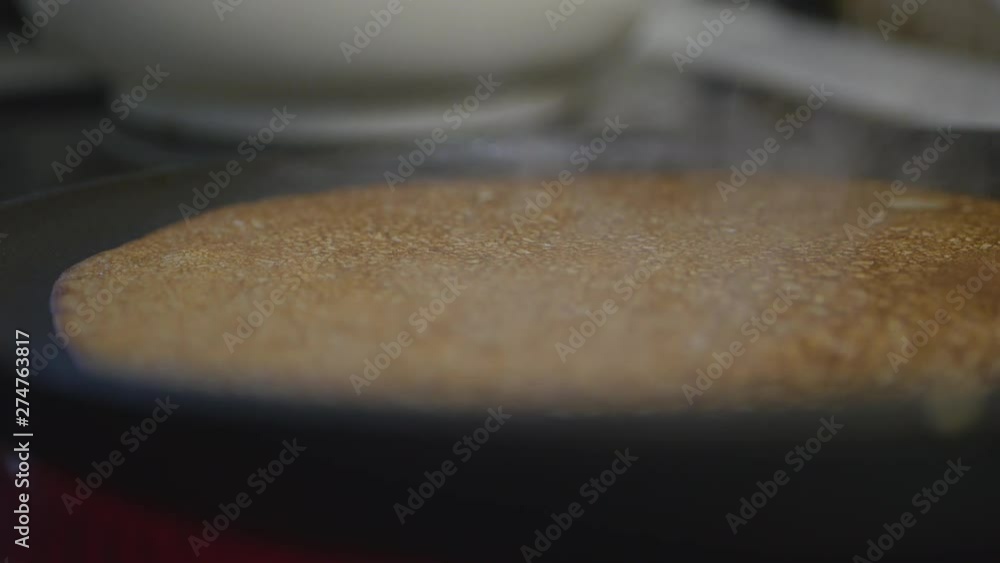 Baking Pancakes On A Frying Pan On Kitchen Stove. Baking Pancakes On A Frying Pan On Kitchen Stove.