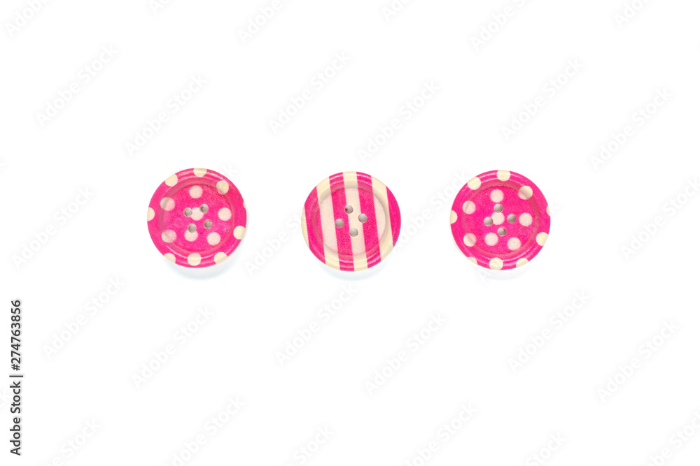 Three Various pink sewing buttons isolated on background Three Various pink sewing buttons isolated on background
