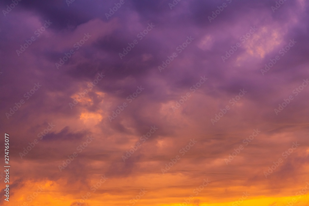 bright gradient clouds of orange and purple at sunset